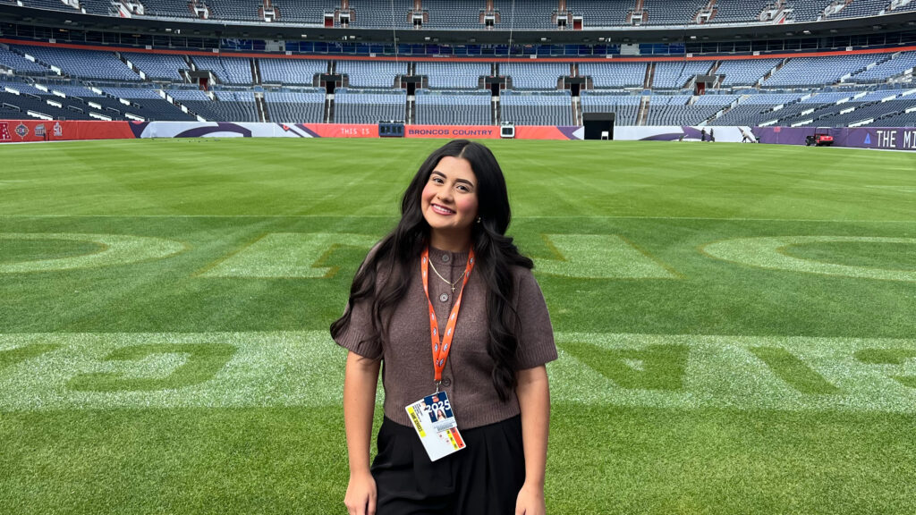 Jasmin Mazariegos Rodriguez standing on the Broncos stadium