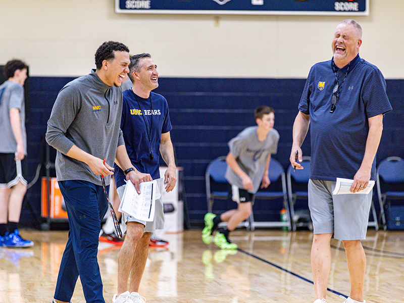 UNC kinesiology faculty members on a basketball court