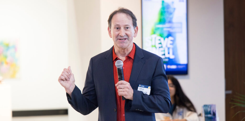 Stephen Ruyle talking into a microphone