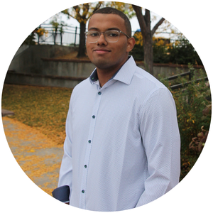 UNC student Marcus Robinson in a button-up shirt.