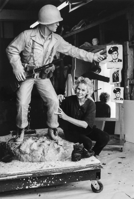 Maxine Schwartz is working on one of her sculptures, a statue of a member of the army