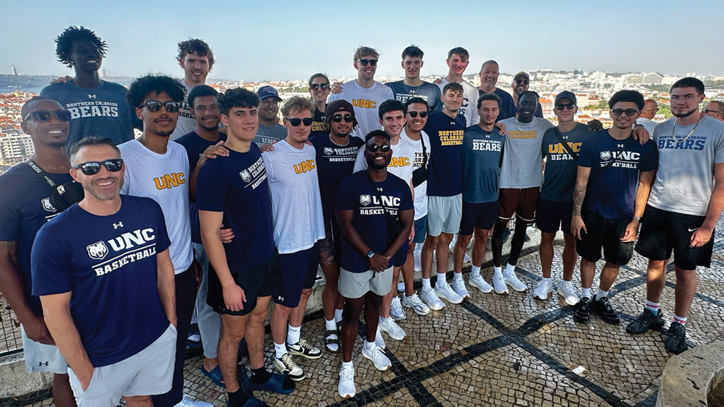 The UNC basketball team posing for a group photo in Portugal.
