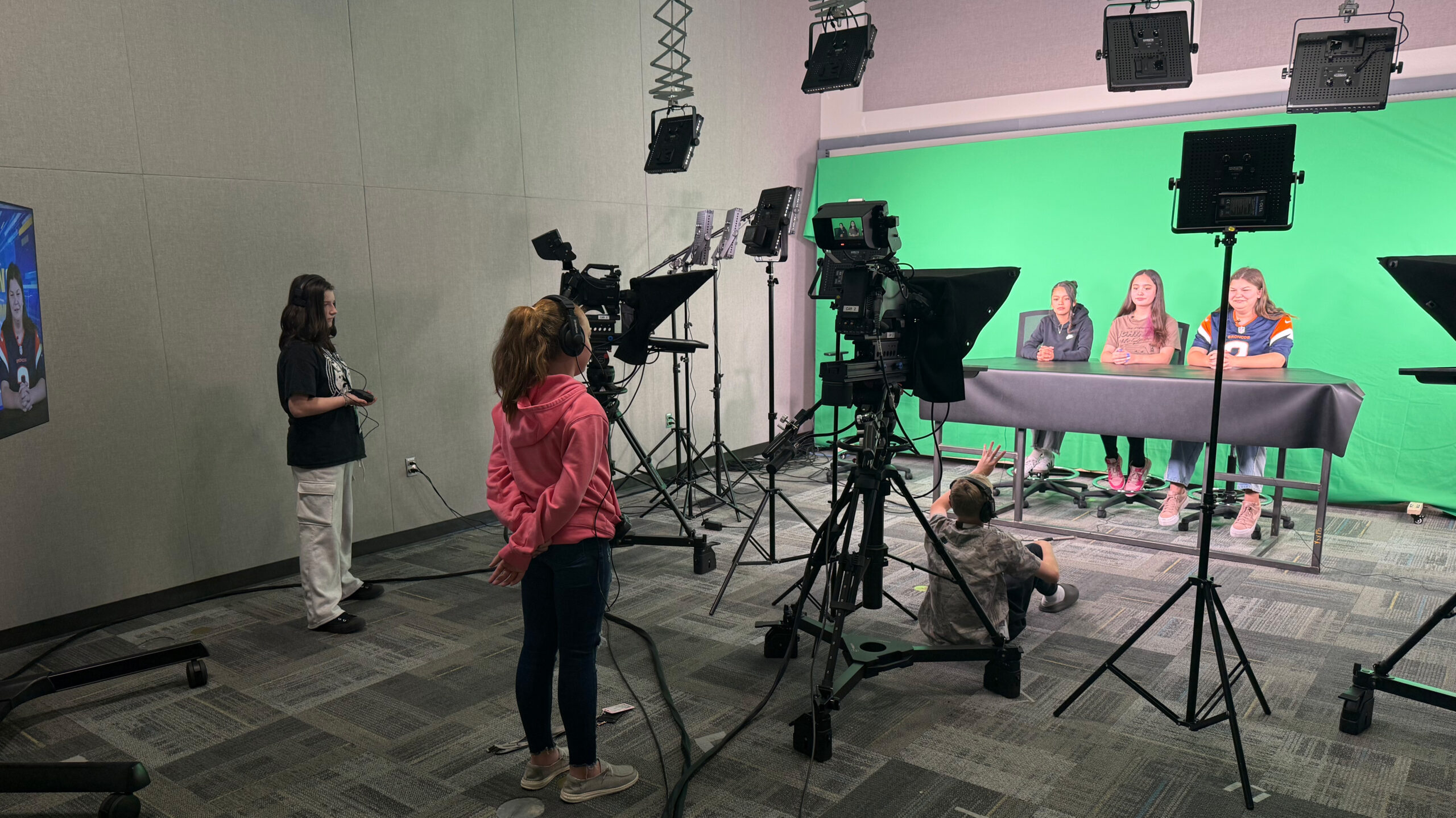 Middle School students inside UNC's broadcasting studio
