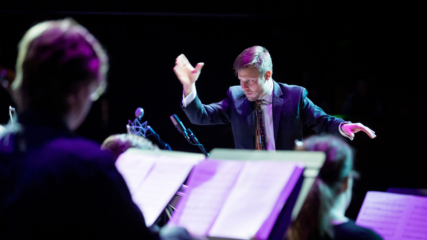A conductor giving direction to a band.