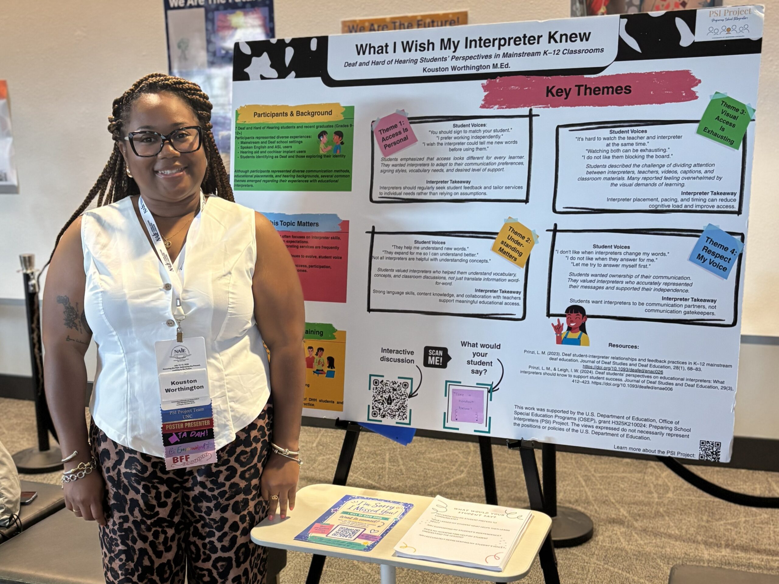 Kouston Worthington standing beside the What I Wish My Interpreter Knew poster at the 2026 NAIE Conference.