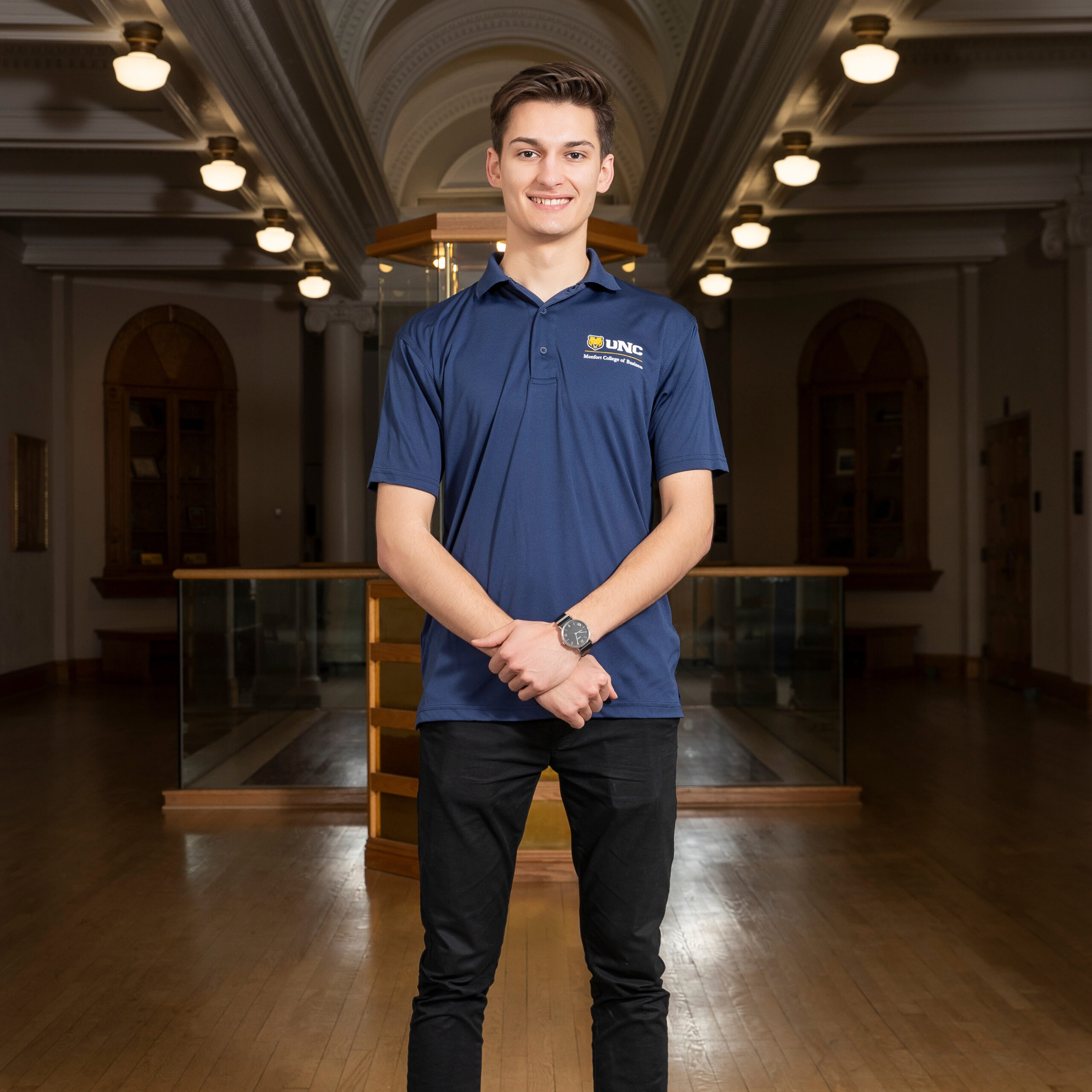 Philip Marshall, recent UNC graduate smiling in Kepner Hall.