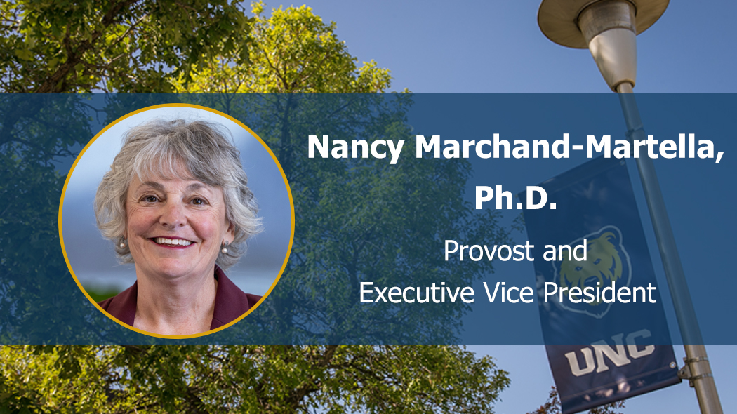 Nancy Marchand-Martella facing forward and smiling on UNC-branded background.