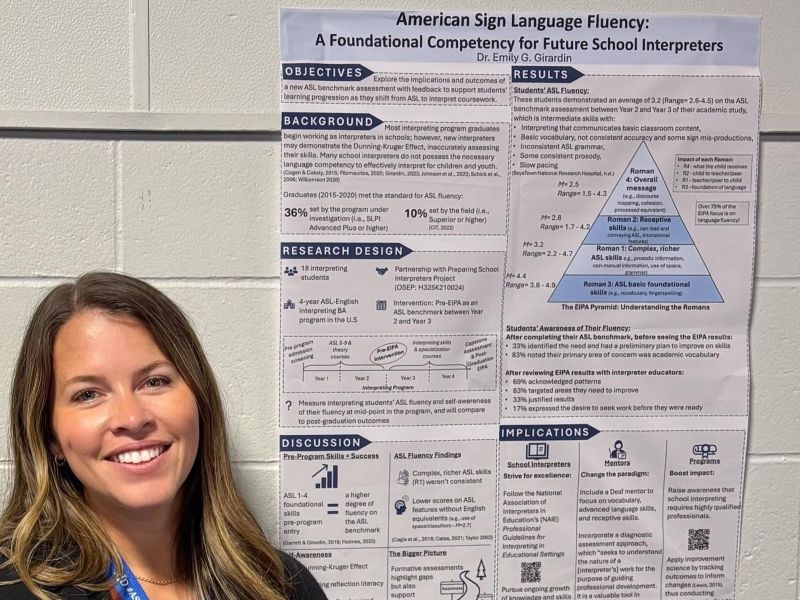 Dr. Emily Girardin presents a research poster at the 2025 Registry of Interpreters for the Deaf Conference.