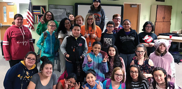 Rachel McGuire's elementary classroom gathering together smiling