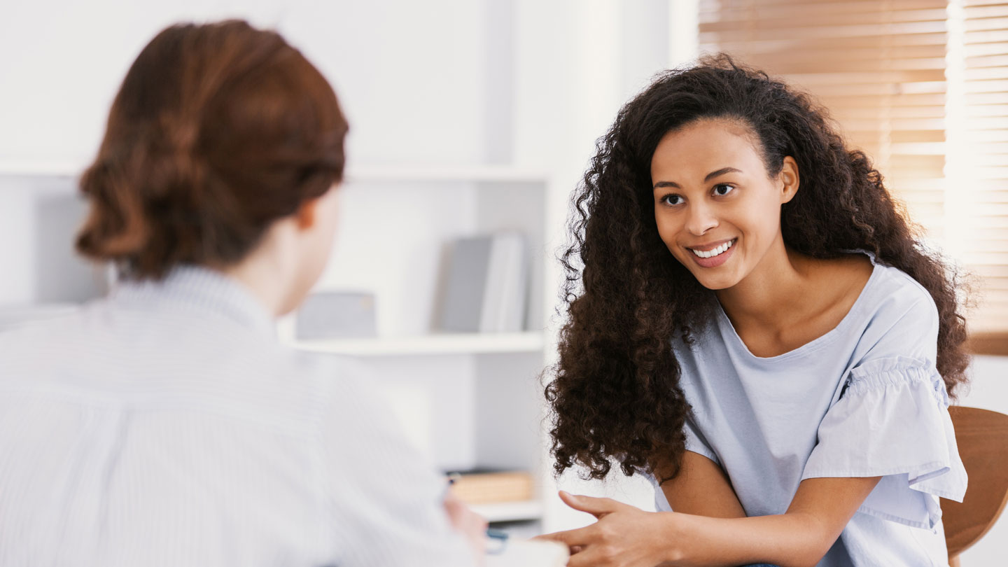 Woman talking to therapist in a counseling session.