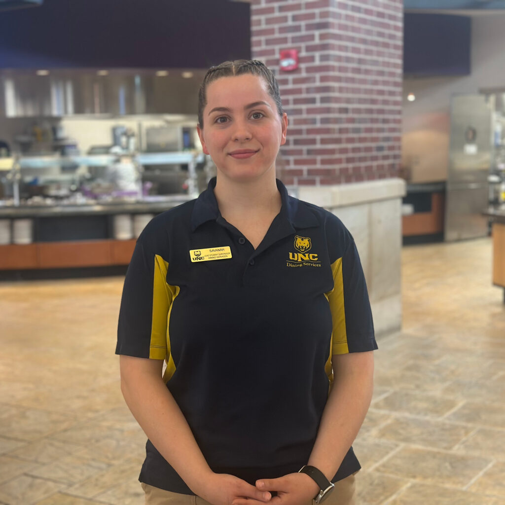 Savannah Mallory, wearing a UNC uniform and smiling at the camera