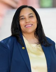 A headshot of Sher Gibbs