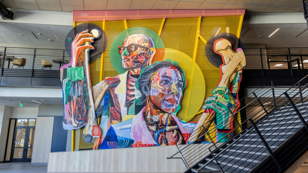 A wide shot of Armando Silva's mural inside the College of Osteopathic Medicine building