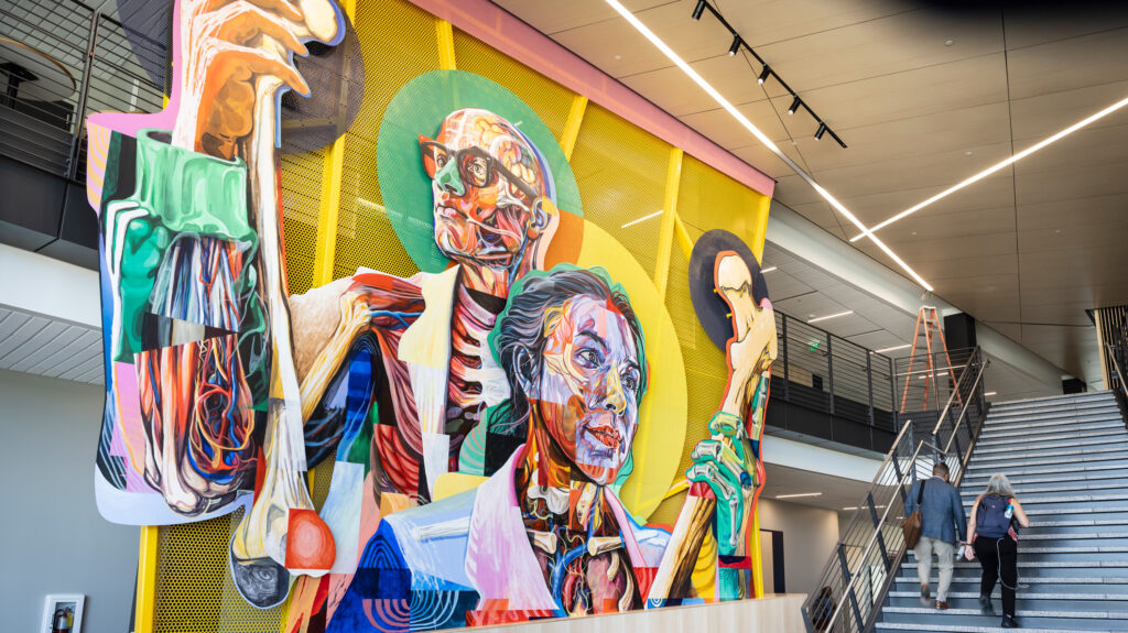 A wide shot of Armando Silva's mural inside the College of Osteopathic Medicine building