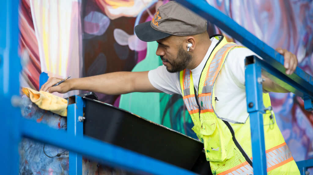 Armando Silva painting his mural