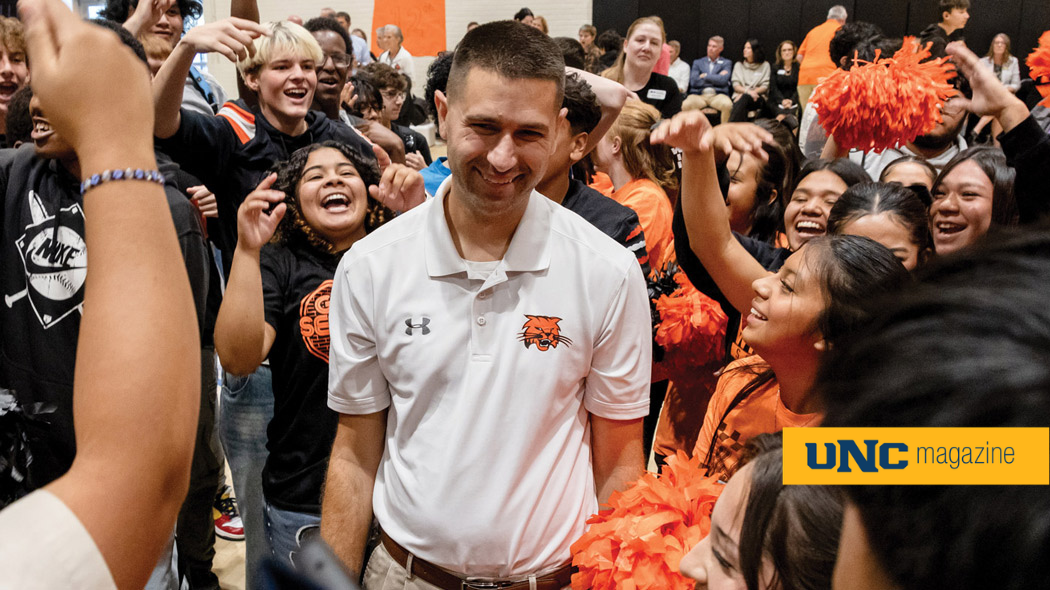 Stephen Paulson, Colorado's 2026 Teacher of the Year, surrounded by cheering high school students.