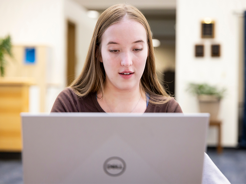 Student looking at their computer.