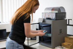 A student using a 3D printer