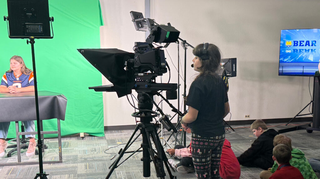 middle school students inside UNC's broadcast studio