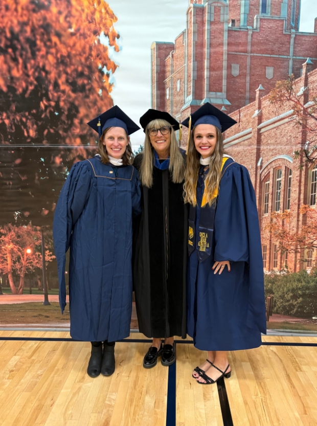 Alumni, Trista Romocki and Jennifer Cuypers pose for a picture with School of Teacher Education Director, Deborah Romero