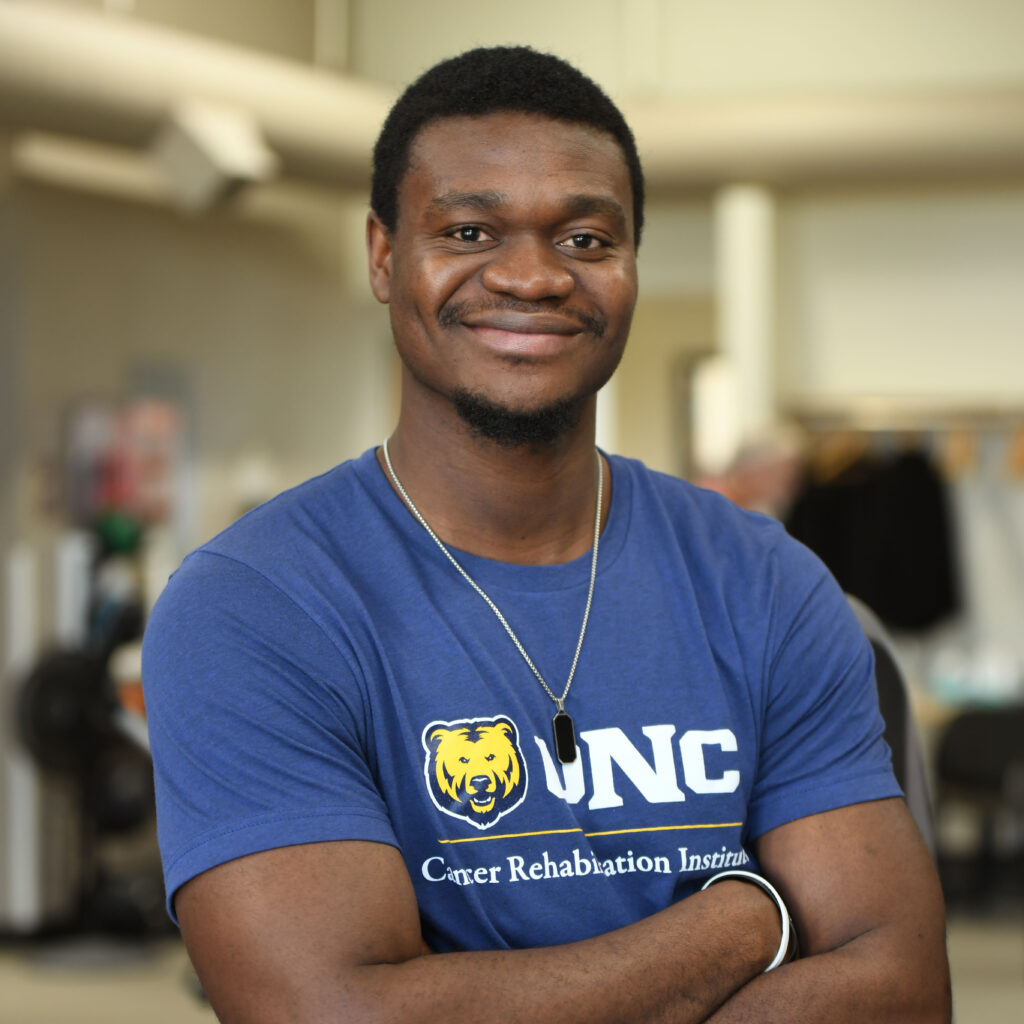 A headshot of Victor Obaro smiling