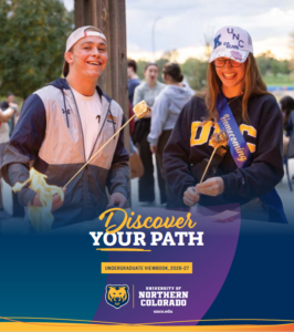 Cover of the Discover Your Path Undergraduate Viewbook. Photo shows two students roasting s'mores on campus.