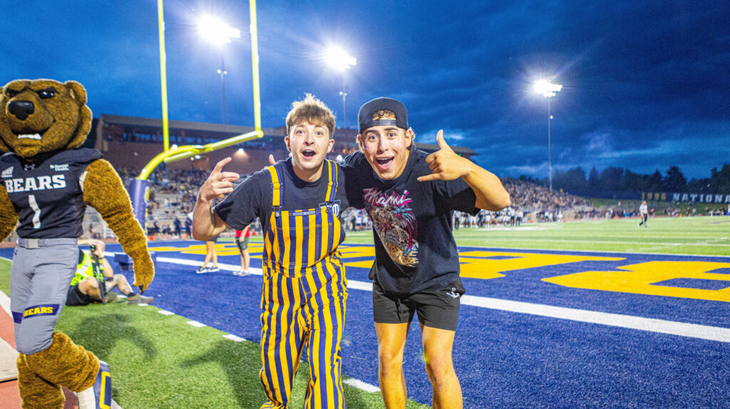 Two UNC fans smiling on Nottingham Field