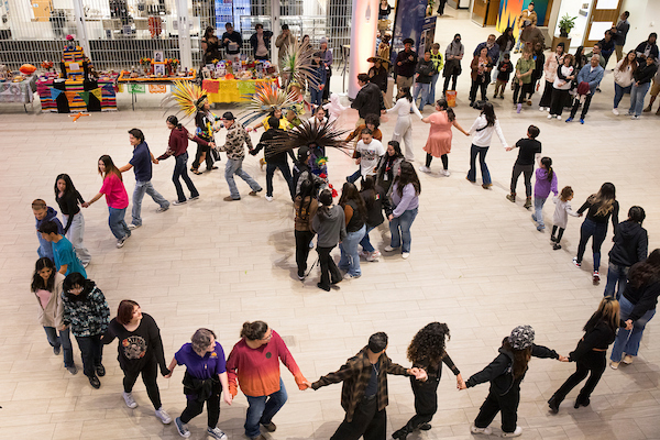A circle dance at UNC's Dia de los Muertos