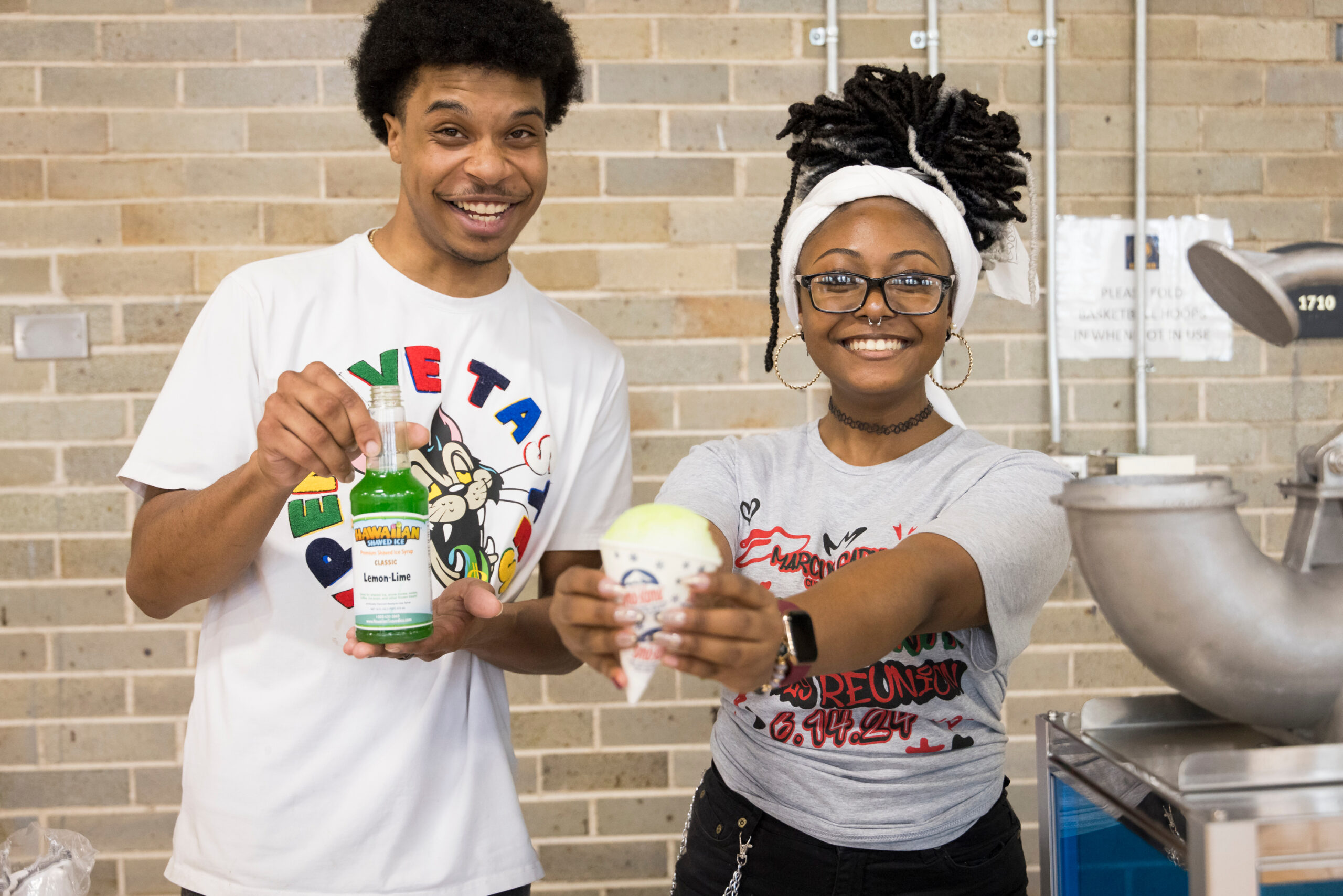 Students at the MGCC's Juneteenth serving snowcones.