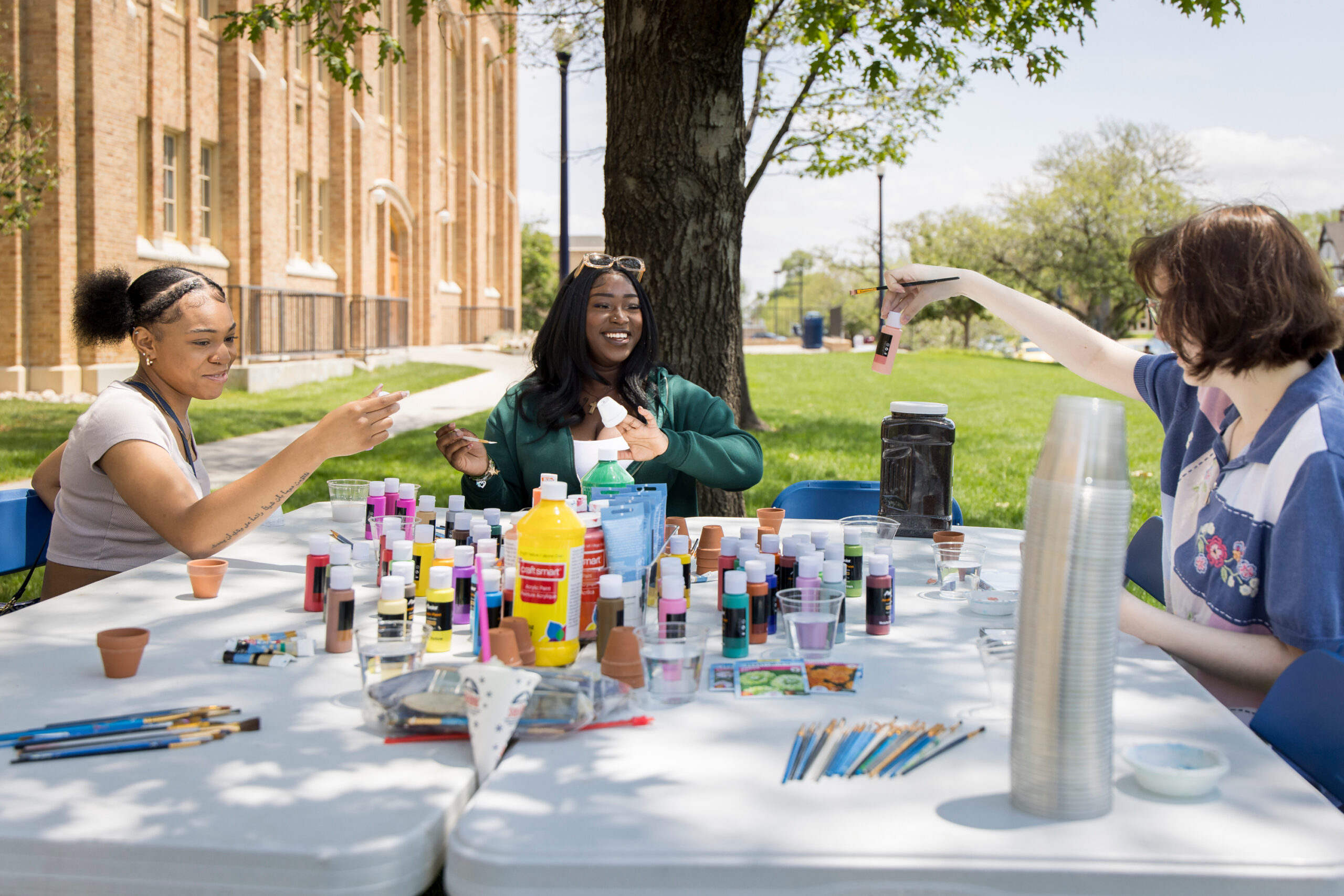 Students at UNC's Gunter Lawn painting during celebration of Juneteenth