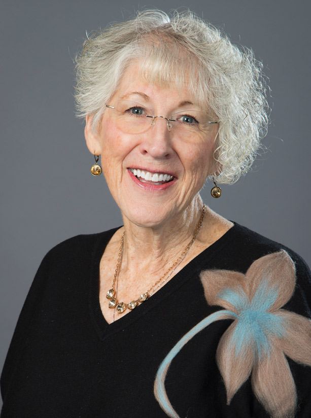Portrait of Kristi Helzer, facing forward and smiling.