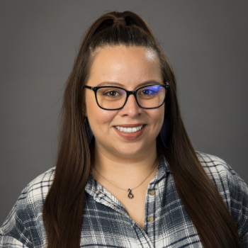 Headshot photo of Samie Gresham in front of a gray background