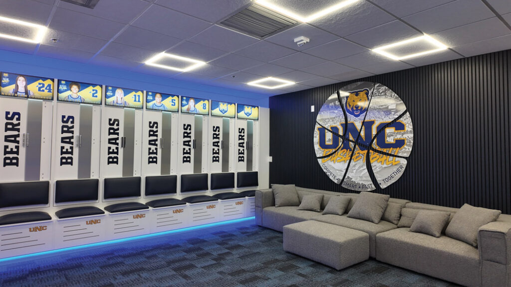 New locker room for UNC Women's Basketball featuring large, custom-designed lockers, bold program branding and a range of new amenities that support performance and well-being.
