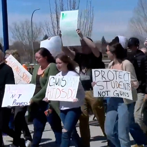 Students marching and protesting gun violence.