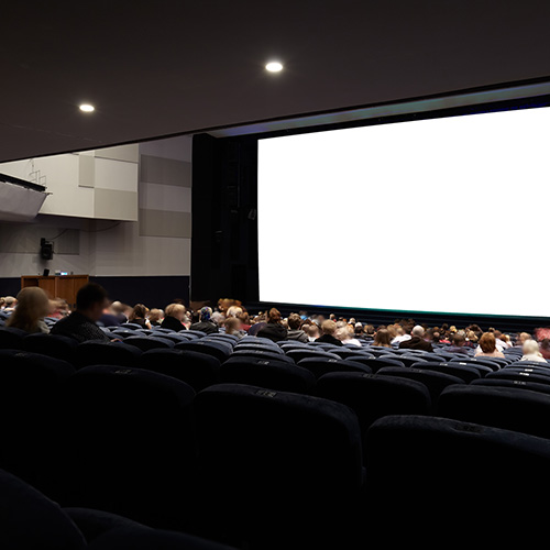 Students sitting in a movie theater.