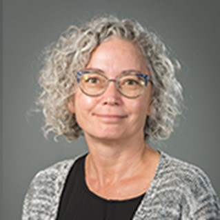 picture of woman with grey hair wearing glasses