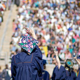 Waving at commencement on Nottingham Field
