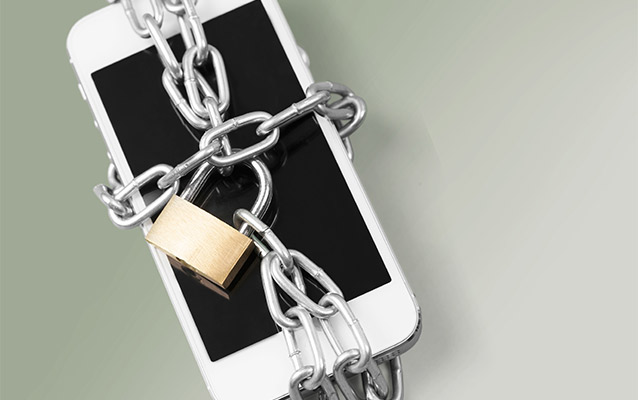 An iphone wrapped in chains