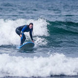 Author surfs off the coast of California