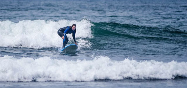 The author surfs off the coast of California