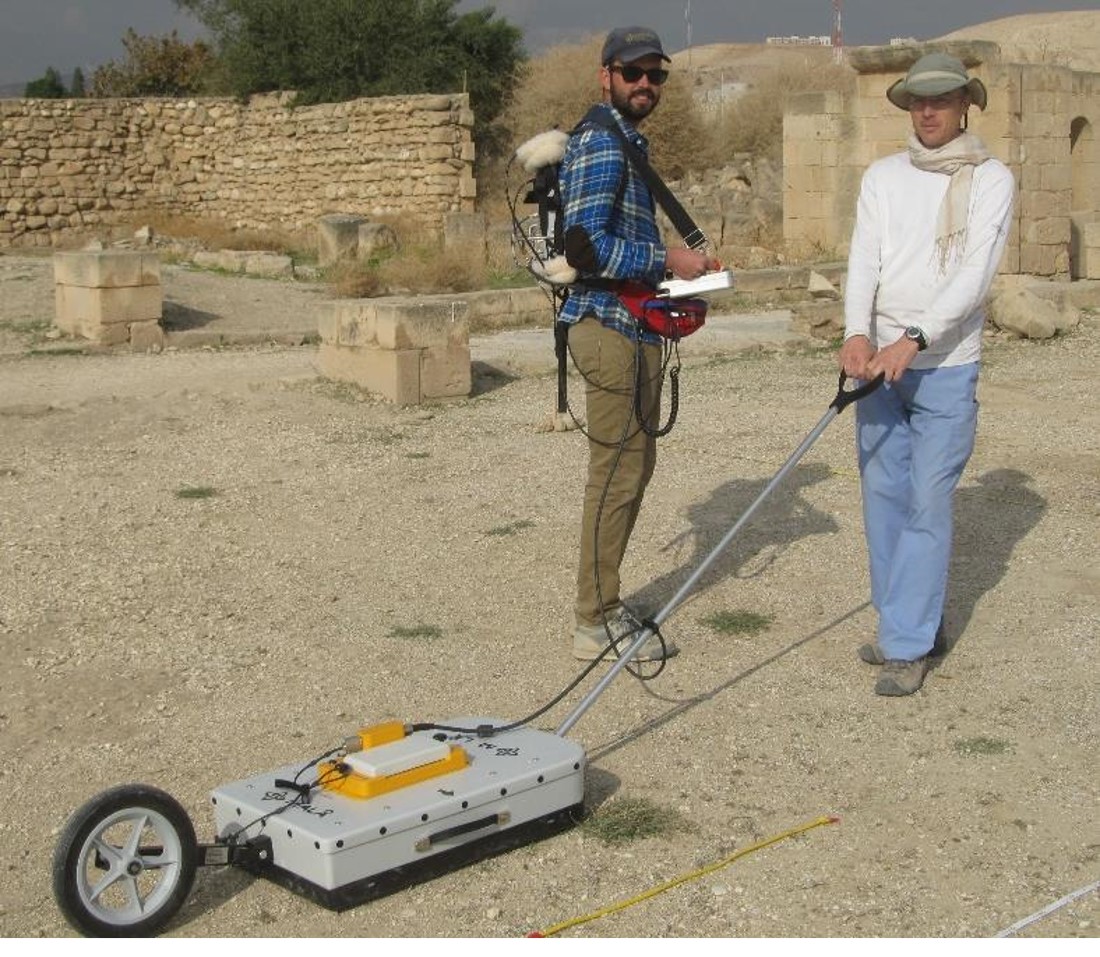Michale and Andy operating a ground-penetrating radar system, Palestine.