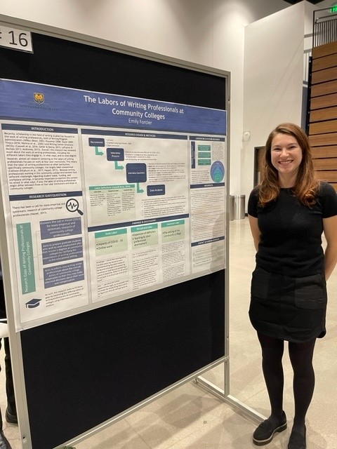 Emily Forcier stands next to a poster detailing her research work