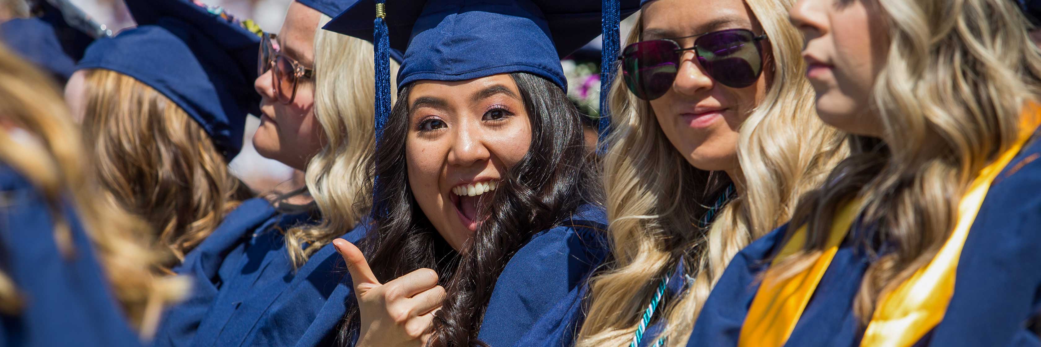 UNC graduate gives a thumbs up