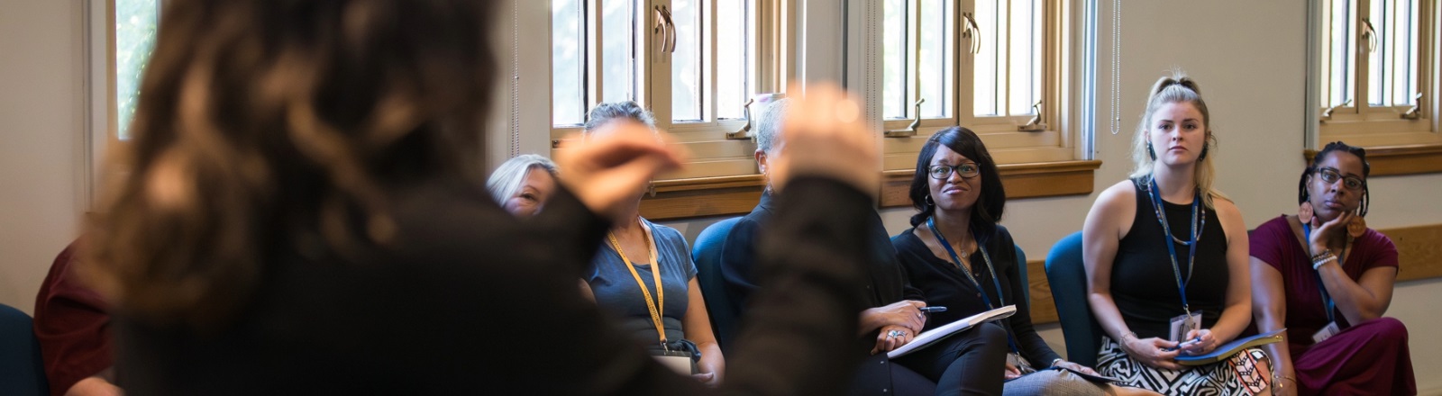 A diverse group of individuals communicating in sign language