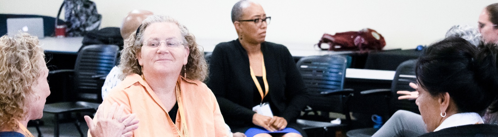 Diverse individuals participating in a small group discussion