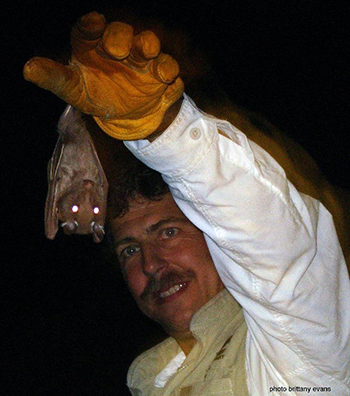 Rick Adams releasing a bat
