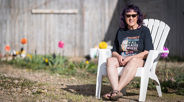 Lady sitting in chair outside