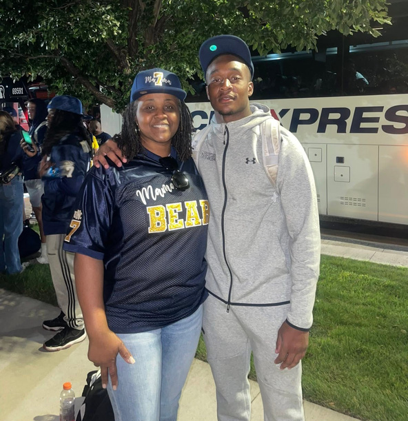 Darrell Bryant standing next to his mom with his arm around her