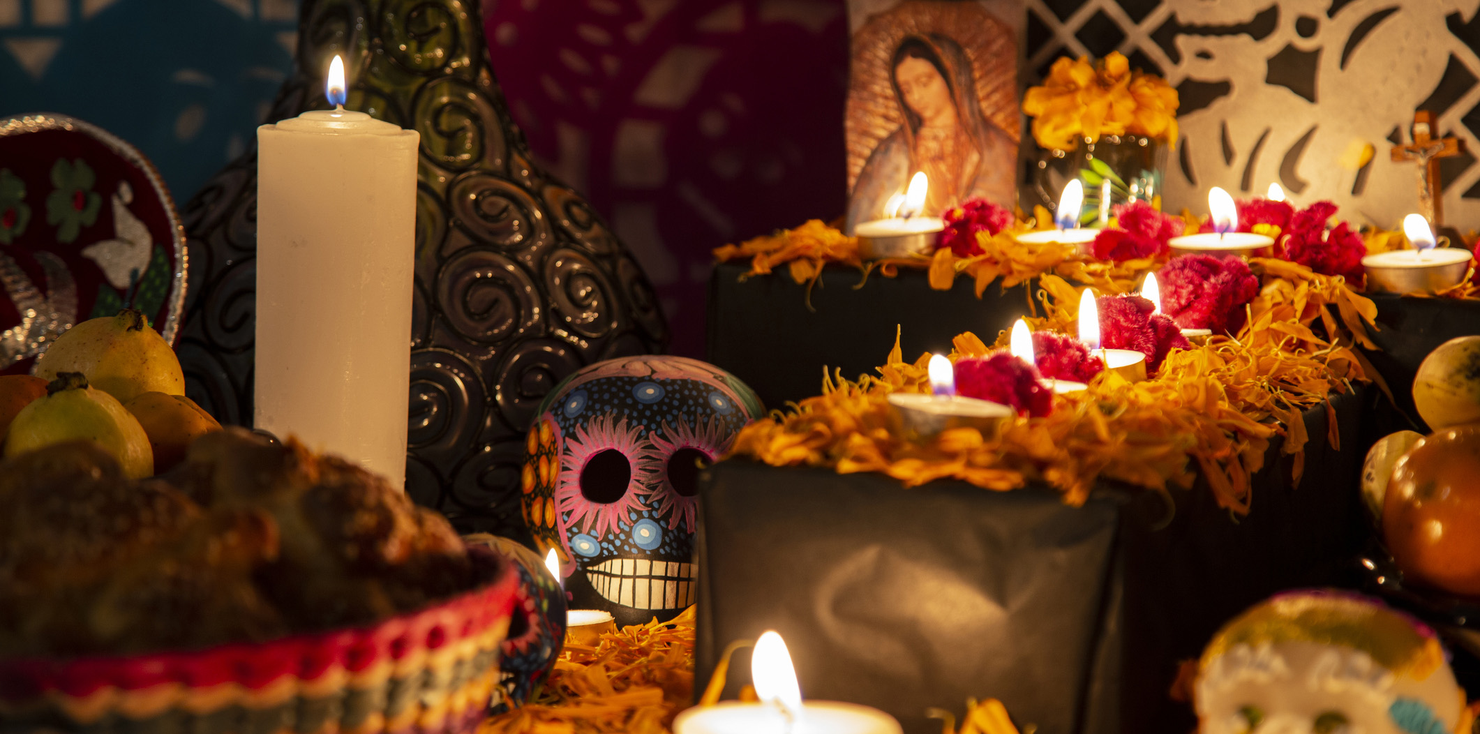 Colorful skull on colorful traditional Day of the Dead "ofrenda" in Puebla, Pue., Mexico