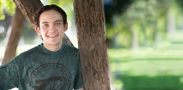 Portrait shot of Dylan Roseman smiling into the camera